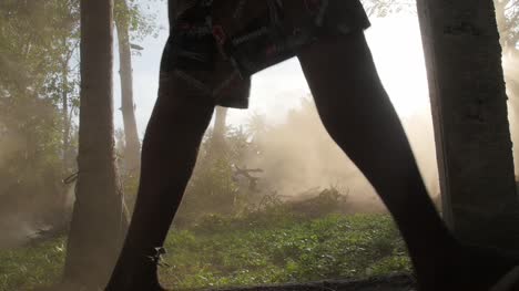 Legs-Walking-Past-Dust-Cloud-in-a-Forest