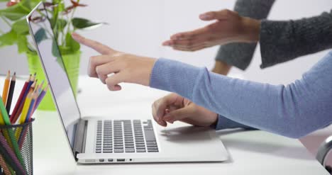 Women-Working-on-Laptop-CU-Hands