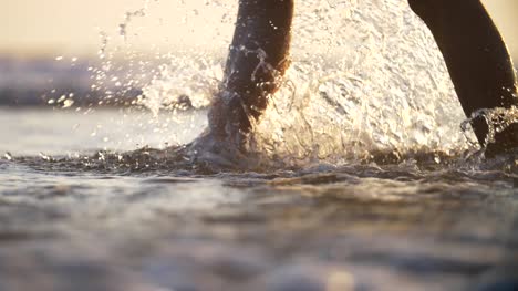 Walking-Through-Surf-and-Kicking-Up-Spray