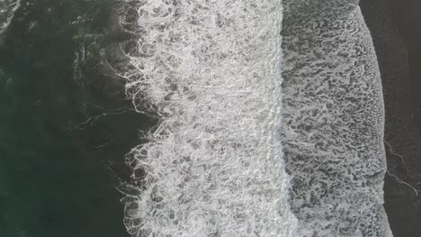 Aerial-View-of-Waves-Crashing-Ashore