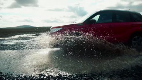 Car-Driving-Through-Puddle-In-Slow-Motion