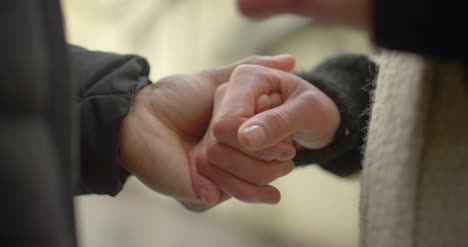 Couple-Holding-Hands-Close-Up