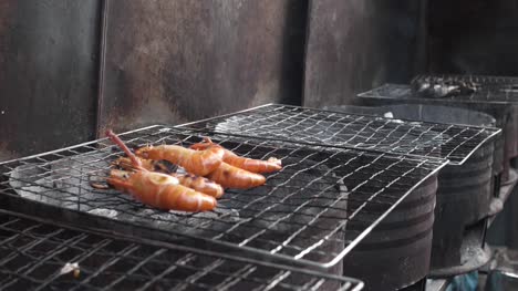 Hand-Putting-Shrimp-on-Barbecue